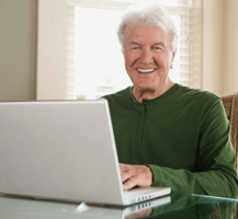 older man with laptop