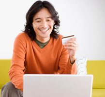 man with laptop and credit card